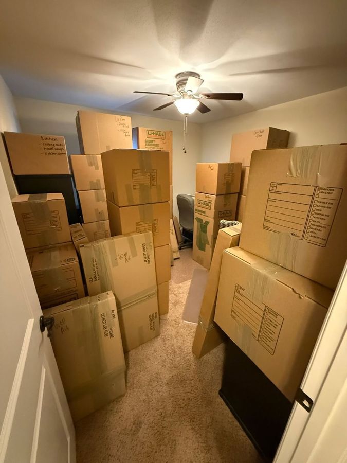 Spare room filled floor to ceiling with moving boxes