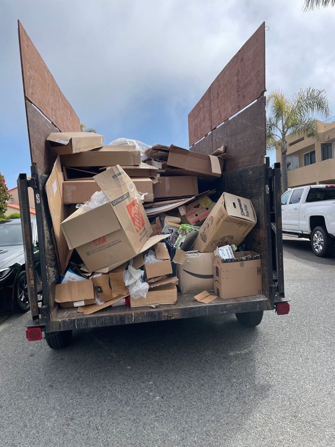 Trailer full of flattened cardboard and packaging